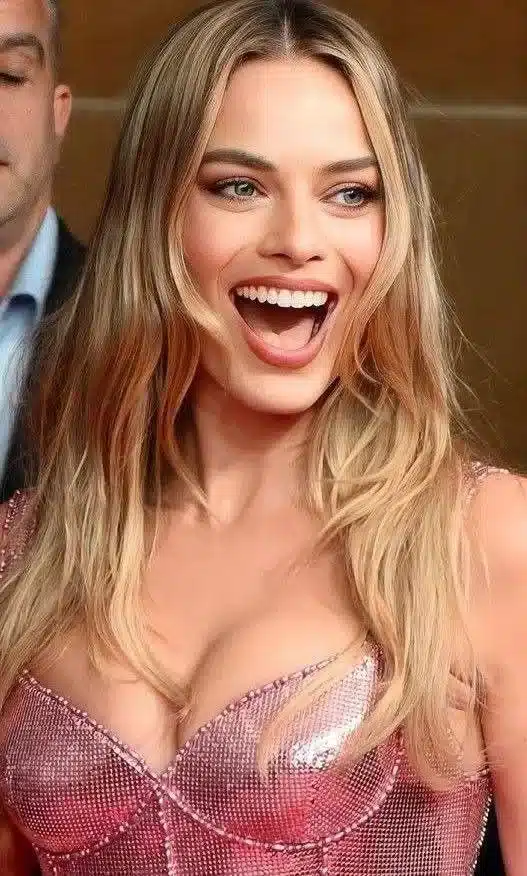 “High-resolution portrait of Margot Robbie’s polished natural smile.”