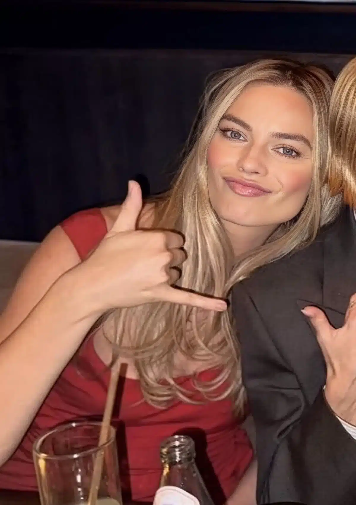 “Margot Robbie’s expressive smile featuring warm-white enamel harmony.”