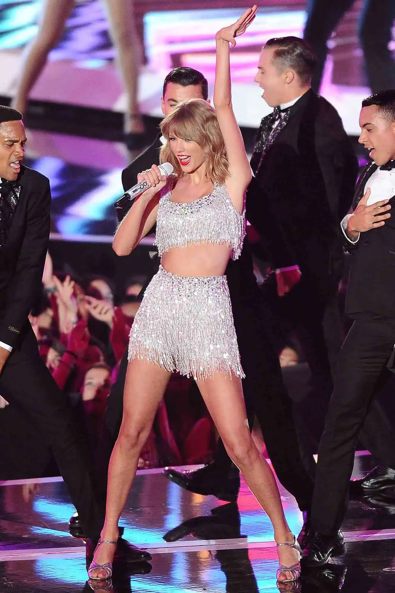 9. “Taylor Swift smiling with gentle corner lift and emotional expression.”