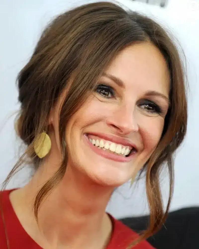 “Julia Roberts with soft lighting highlighting her iconic expressive smile.”