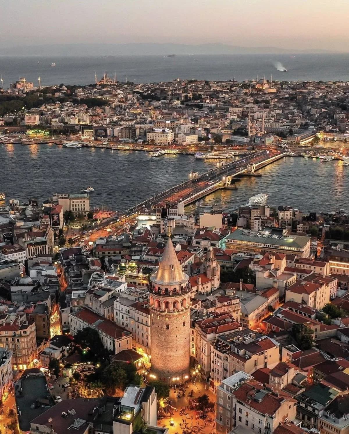 Aerial view of Galata Tower and the Golden Horn at dusk in Istanbul