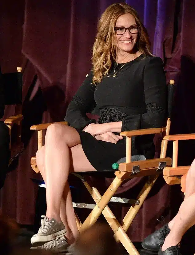 “Julia Roberts wide laugh showing upper and lower teeth with natural balance.”