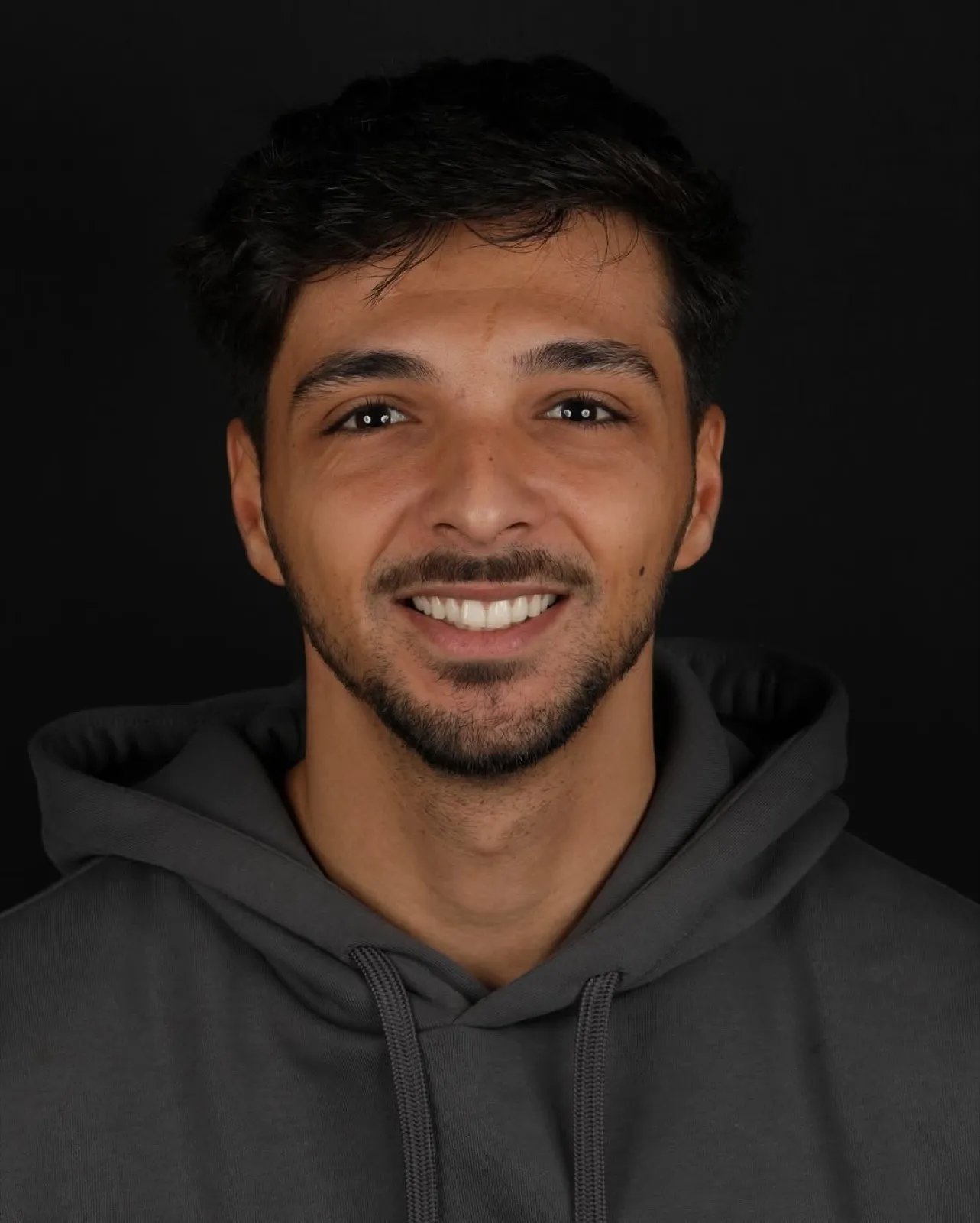 Before veneer treatment, full face portrait of male patient with natural smile, Turkey dental clinic.