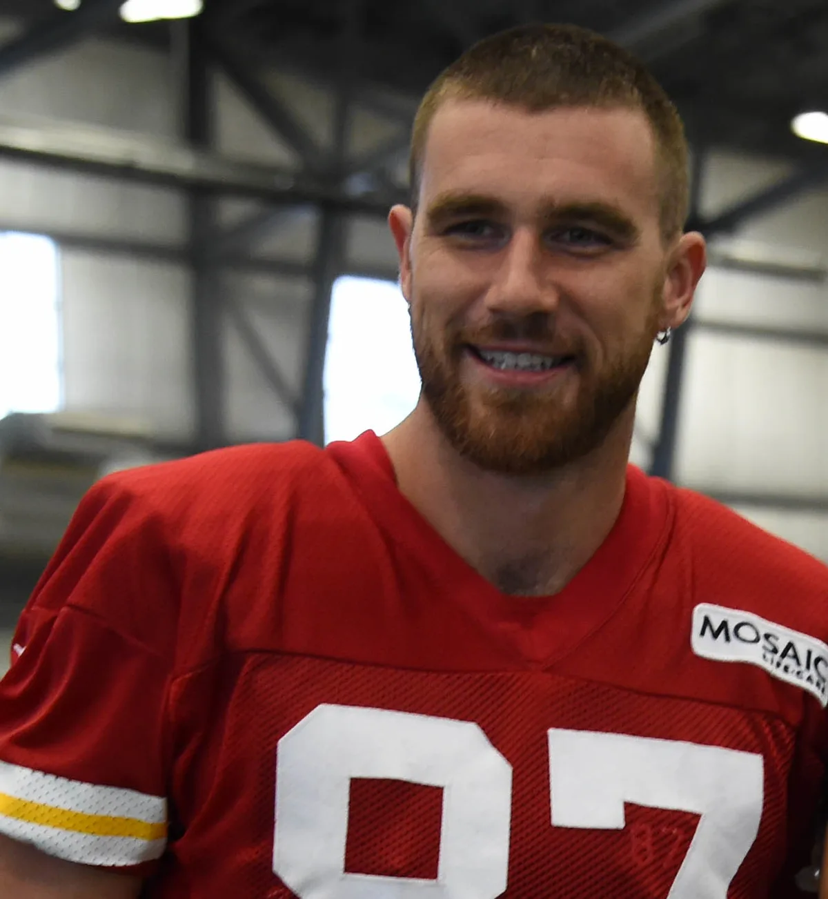 Travis Kelce smiling in 2017, at Chiefs training camp