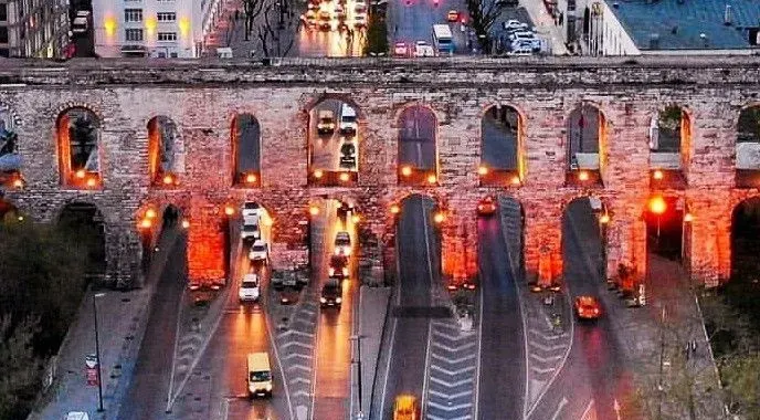 The historic Valens Aqueduct in central Istanbul, illuminated at dusk