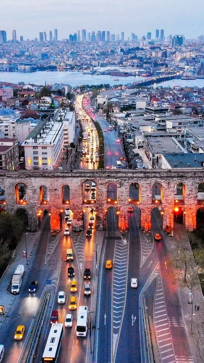 Evening skyline view of Istanbul beyond the Valens Aqueduct