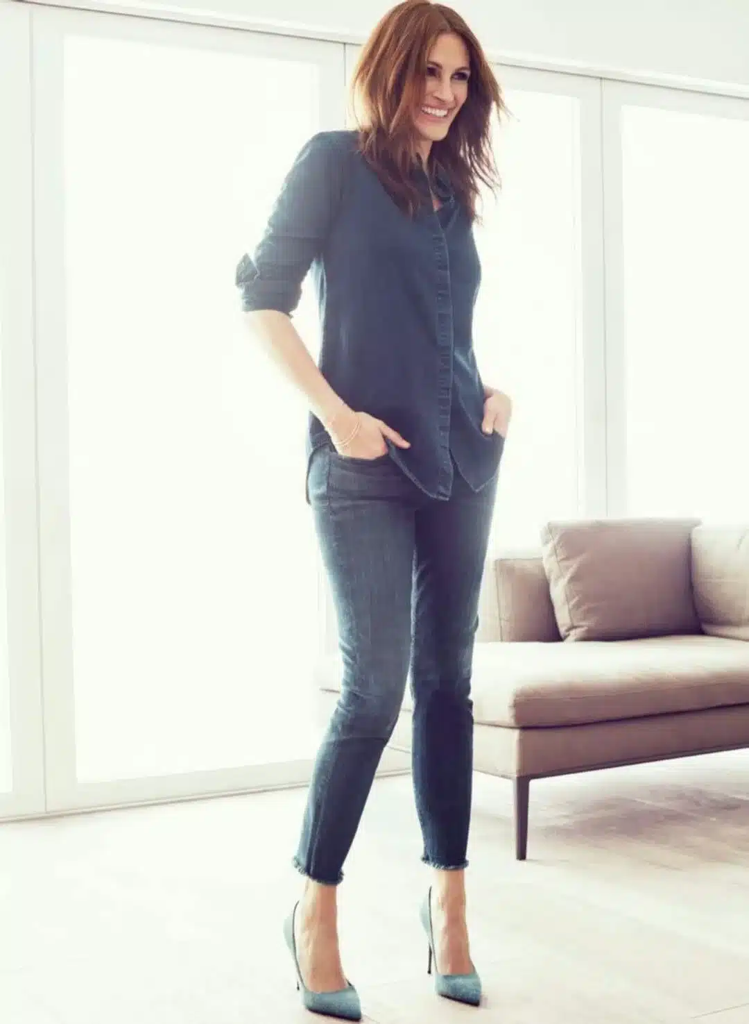 “Julia Roberts in a candid laugh displaying natural gum show and bright enamel.”