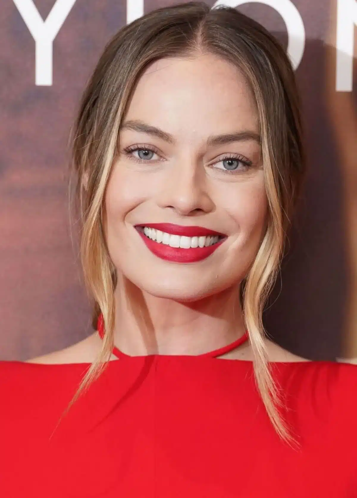 “Margot Robbie’s expressive smile featuring warm-white enamel harmony.”