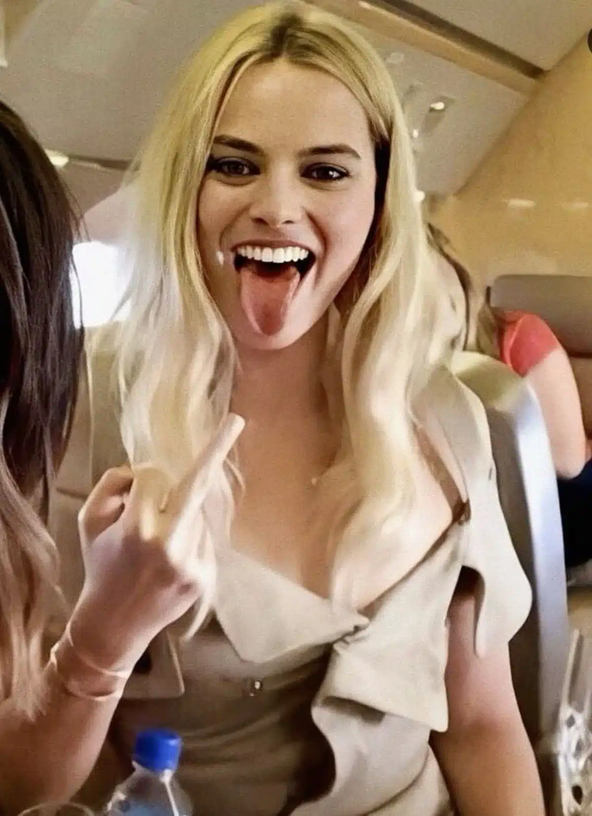 “Margot Robbie’s expressive smile featuring warm-white enamel harmony.”
