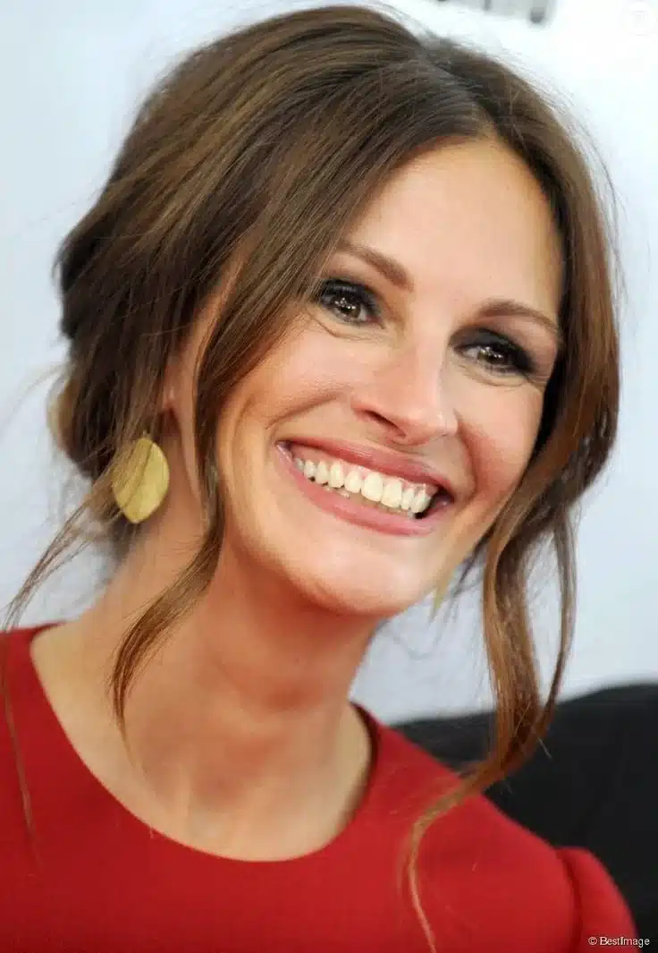 “Julia Roberts with soft lighting highlighting her iconic expressive smile.”