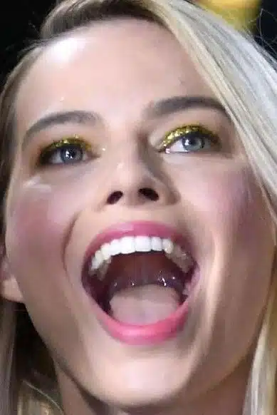 “Margot Robbie’s elegant smile demonstrating natural feminine design.”