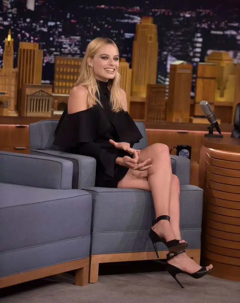 The Feminine Geometry Behind Margot Robbie’s Smile 54 “Margot Robbie laughing naturally with expressive lip movement.”