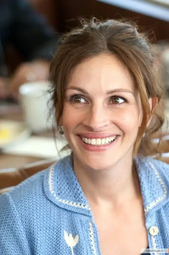 “Julia Roberts smiling with iconic warmth and high lip mobility.”